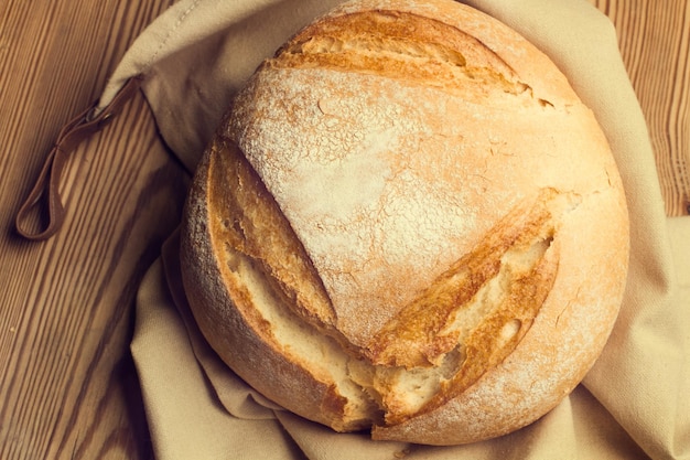 Loaf of bread on a wooden table