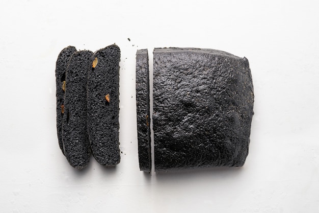 Loaf of charcoal bread and knife