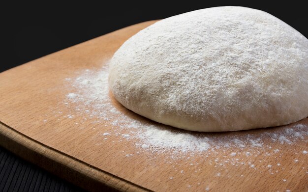 Loaf dough on wooden board