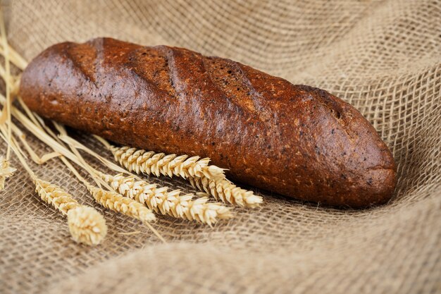 Loaf of Flavored Rye Grain Bread on Burlap