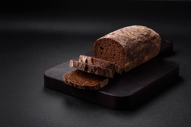 Loaf of fresh crispy brown bread with grains and seeds