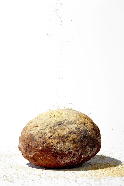 A loaf of rye bread on a white background