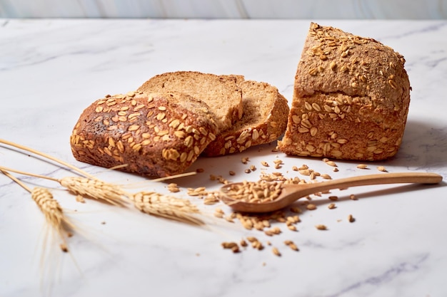 A loaf of sourdough rye bread on a rustic wooden board