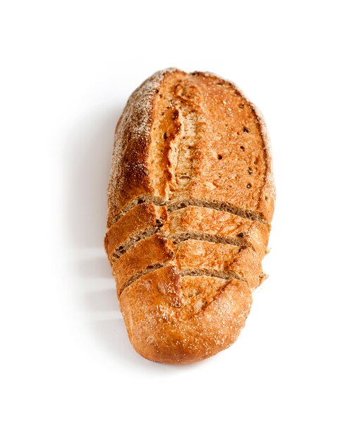 Loaf of whole wheat bread with slices isolated on white background