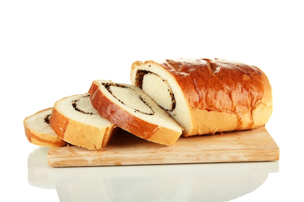 Loaf with poppy seeds on cutting board, isolated on white