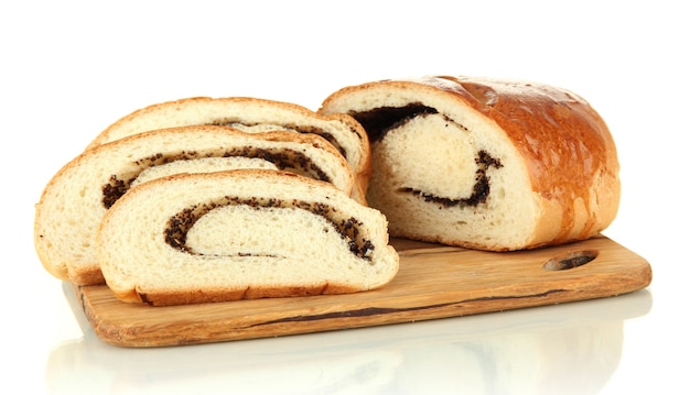 Loaf with poppy seeds on cutting board, isolated on white