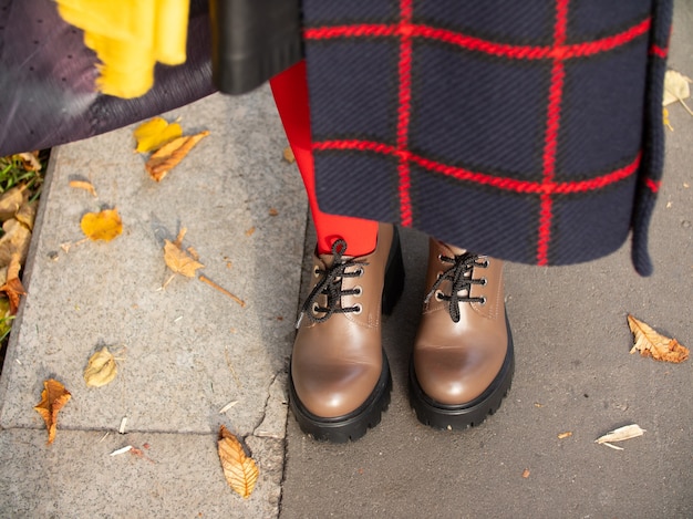 Photo loafers, autumn coat, autumn clothes for walking in the park in autumn