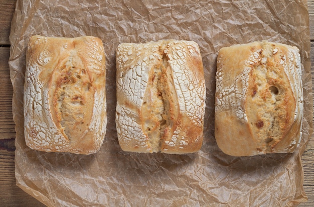 Loaves of buns on crumpled paper