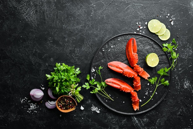 Lobster claws Seafood on a black background Top view Free copy space