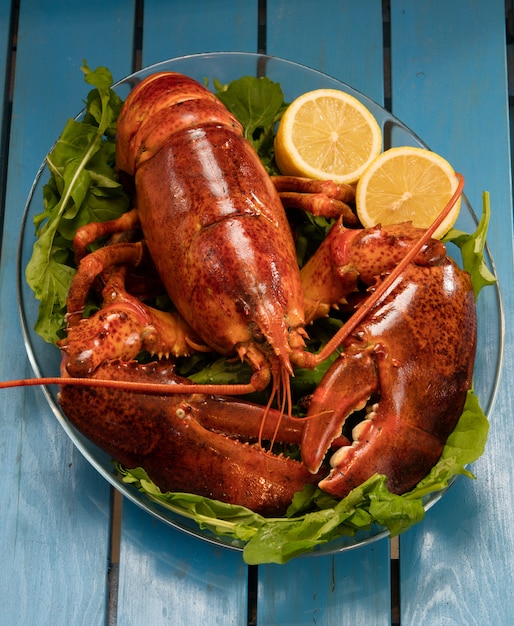 Lobster dinner with lemon and lettuce garnish