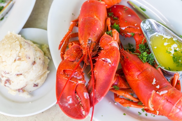 Lobster dinner with potato salad and butter