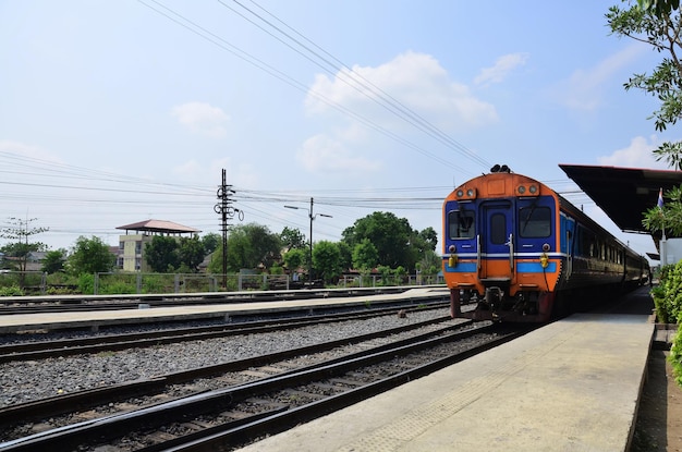 Local bogie locomotive train on track railway stop waiting for\
send receive thai people and foreign travelers passengers journey\
go to destination at phra nakhon si ayutthaya city in bangkok\
thailand