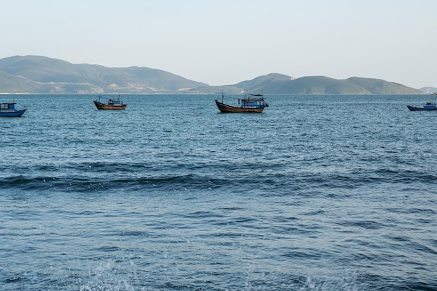 Local fishing boats on sea Vintage colourful boats with fishing nets