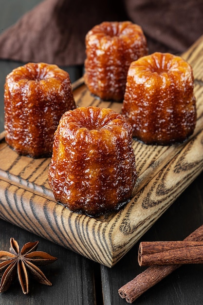 Local french dessert canele on a wooden board