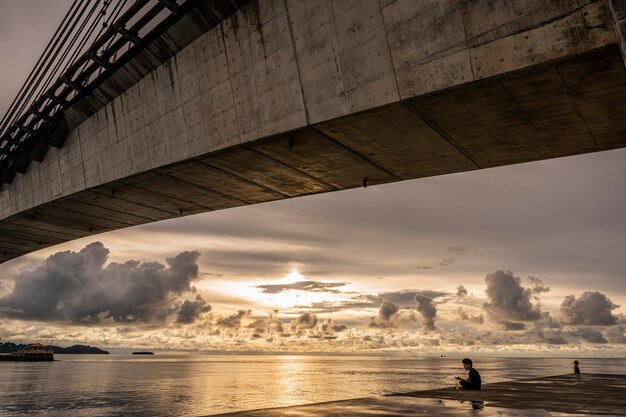 A local Palauan child enjoys tea and sunset