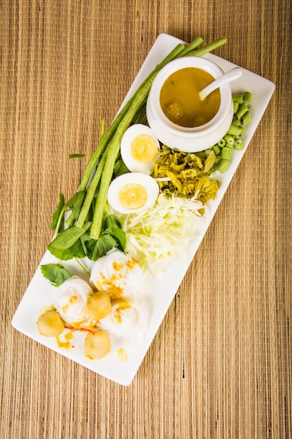 Local Rice vermicelli and curry sauce with vegetable Kanom Jeen Nam Ya