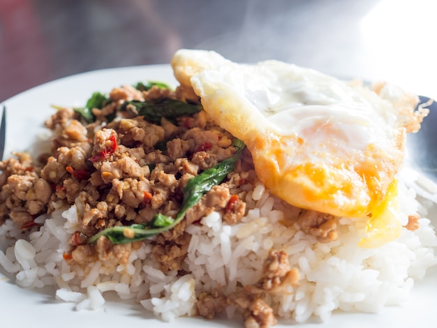 Local street food Thai rice topped with stir-fried pork basil and fried egg.