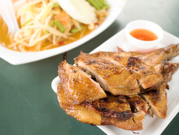 Local thai food Somtum and Gaiyang, Papaya spicy salad and griled chicken.