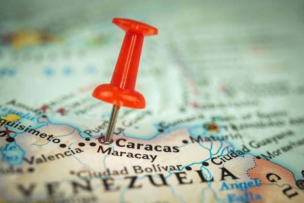 Location Caracas and Maracay city in Venezuela red push pin on the travel map marker and point closeup tourism and trip concept South America