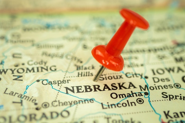 Location nebraska state map with red push pin pointing closeup\
usa united states of america