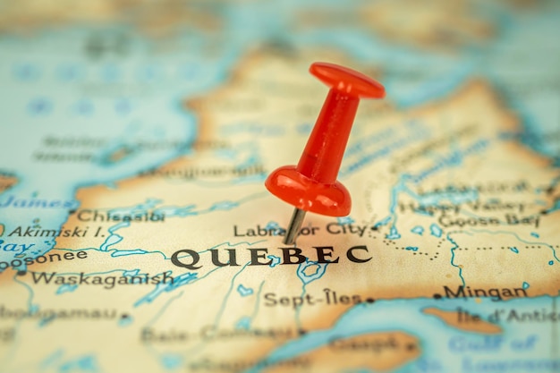Location quebec province in canada map with red push pin\
pointing closeup north america