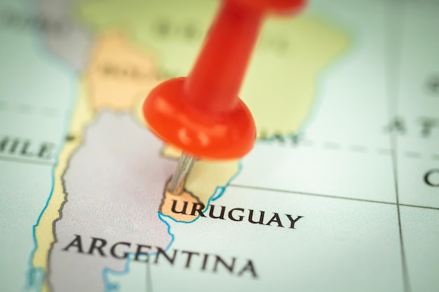 Location Uruguay red push pin on the travel map marker and point closeup tourism and trip concept South America