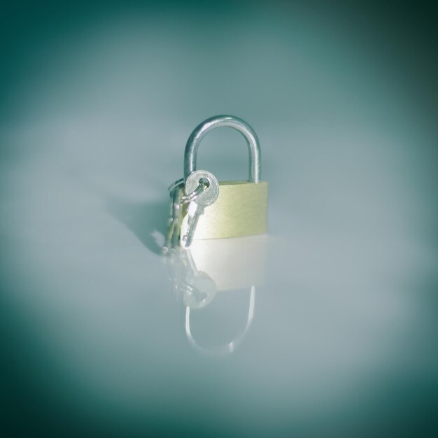 Photo lock and keyisolated on a dark background