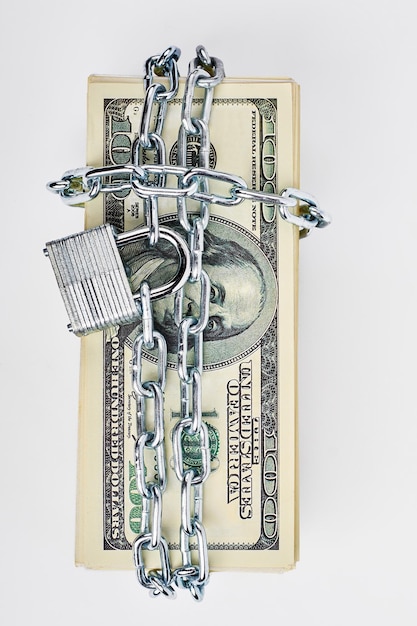 Photo locked stack of dollar bills