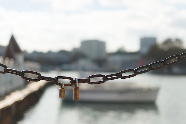 Locks on a metal chain on the street