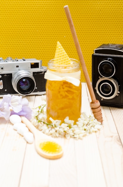 Locust Honey Retro Jar with locust blossoms, and small white stones