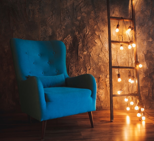 Loft interior with blue armchair