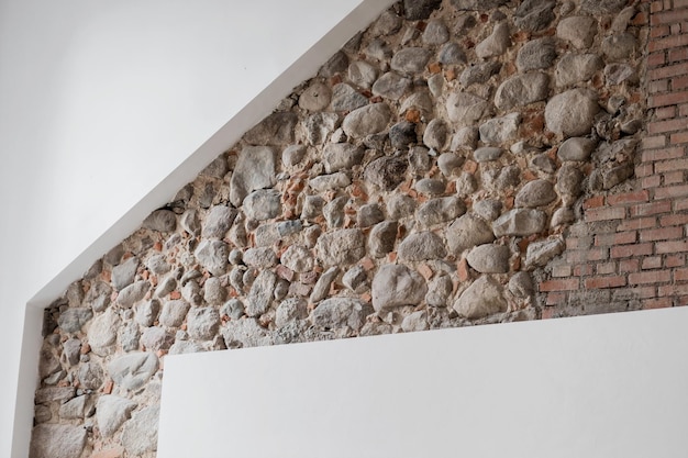 Photo loft room with stone wall