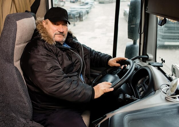 Logistics a driver or freight forwarder in the cover of a truck and trailer driver at a transshipment point