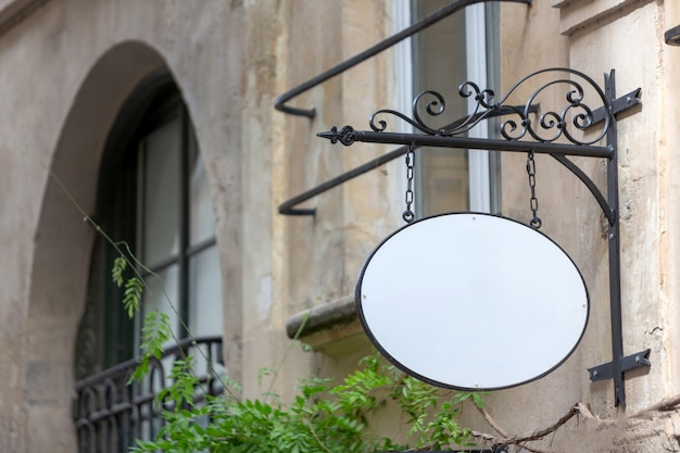 of a logo sign in front of a shop