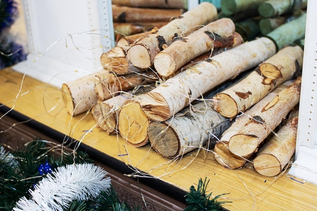 Logs of firewood in a decorative fireplace