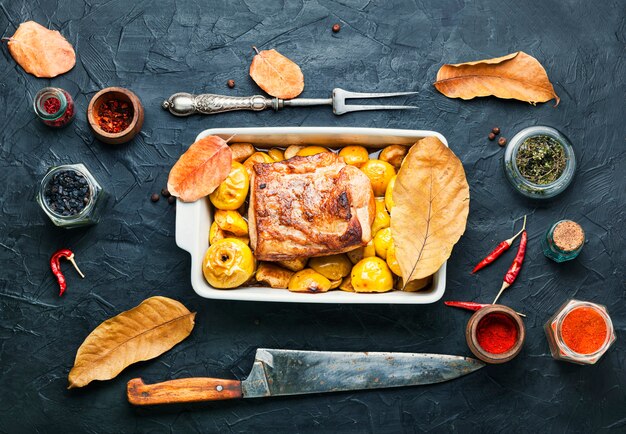 Loin stew with fruit.Baked meat with apples in baking dish