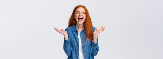 Lol so funny amused and carefree pretty redhead female student clap hands applause with closed eyes 