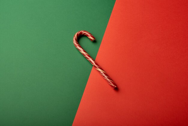 Lollipop cane on bright green and red background