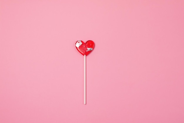 Lollipop Heart on Pink Background Sweet Red Heart Shape Candy on Stick Symbol of Love 14 February