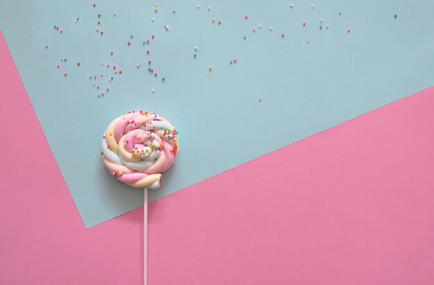 Lollipop on pastel background.