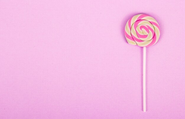 Photo lollipop on pink background.