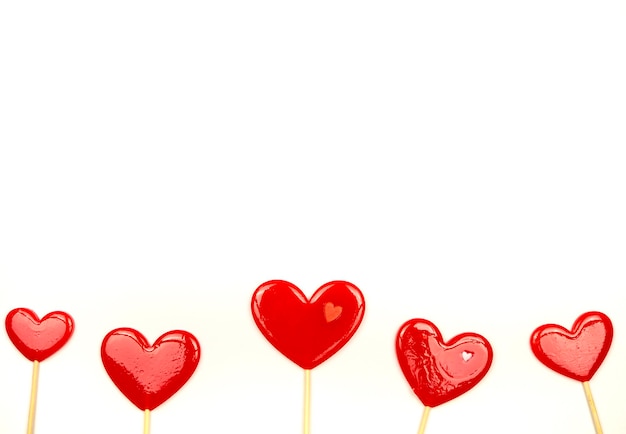 Lollipops hearts on white background Congratulations space for text