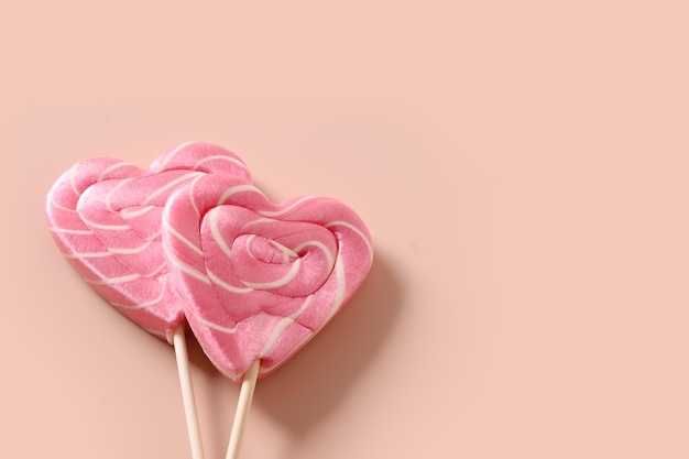 Lollipops pink candy on stick Valentine's day romantic greeting card