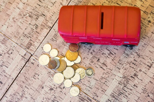 London bus piggy bank with coins