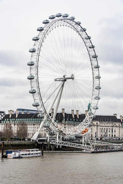 London Eye with office buildings