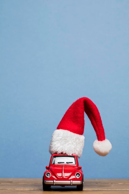 LONDON UK DECEMBER 15th 2016 Christmas background concept with red toy car aginst blue background