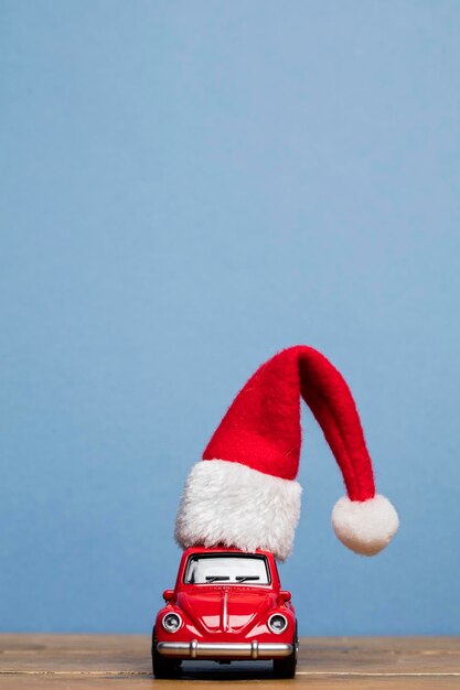 LONDON UK DECEMBER 15th 2016 Christmas background concept with red toy car aginst blue background