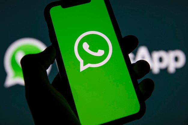 Photo london uk march 2021 whatsapp online messaging service logo on a smartphone