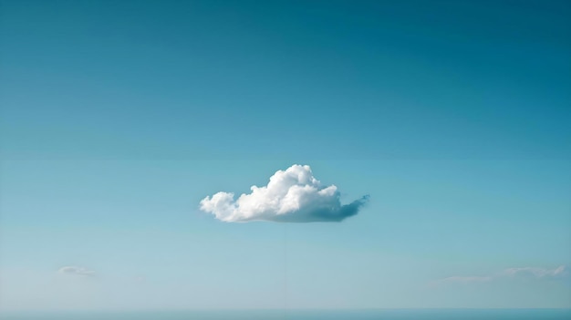 a lone cloud in a blue sky above the ocean