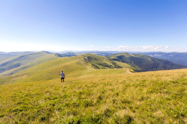 Lonely hiker standing in mountains